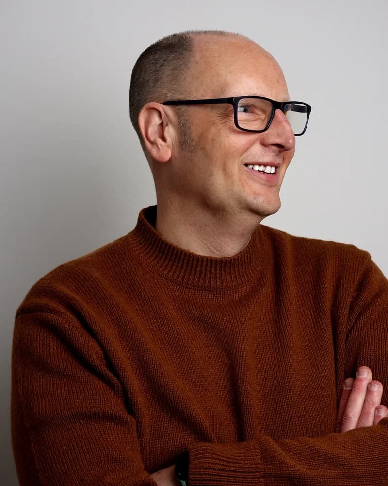 David Todd, smiling, in a rust-coloured jumper.