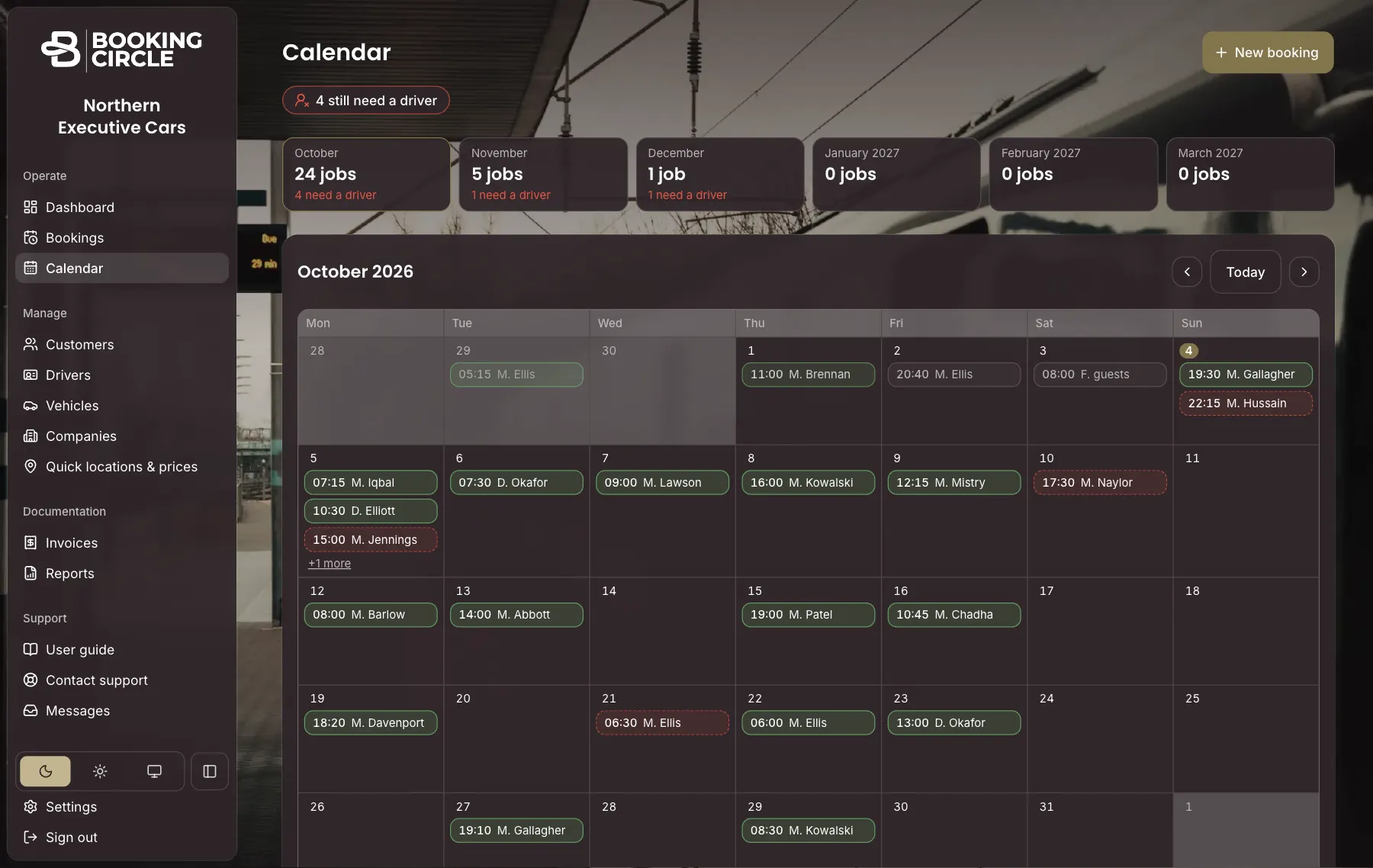 The Booking Circle calendar for October: month totals showing how many jobs still need a driver, and a month grid of jobs coloured green when a driver is assigned and red when not.
